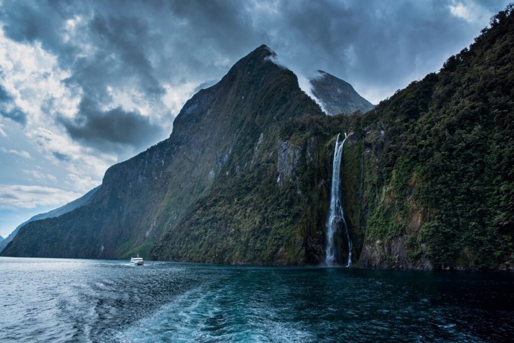 Spectacular Milford Sound waterfalls during cloudy day, fiordland national park